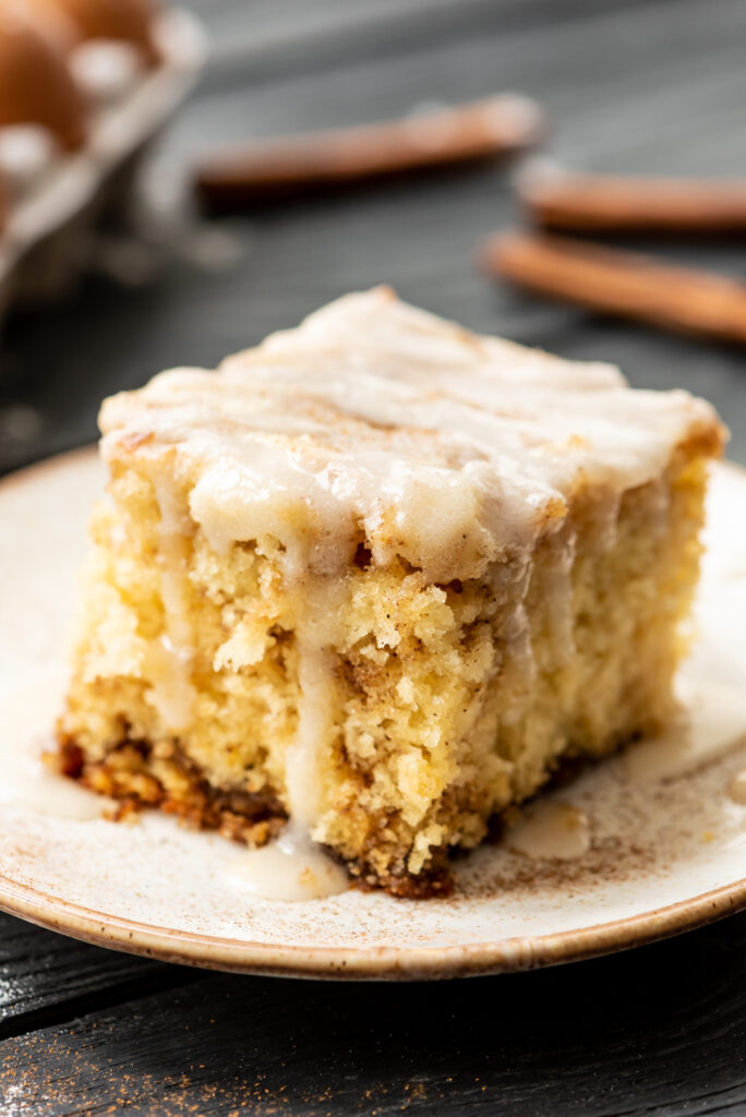 a serving of cinnamon roll cake on a plate.