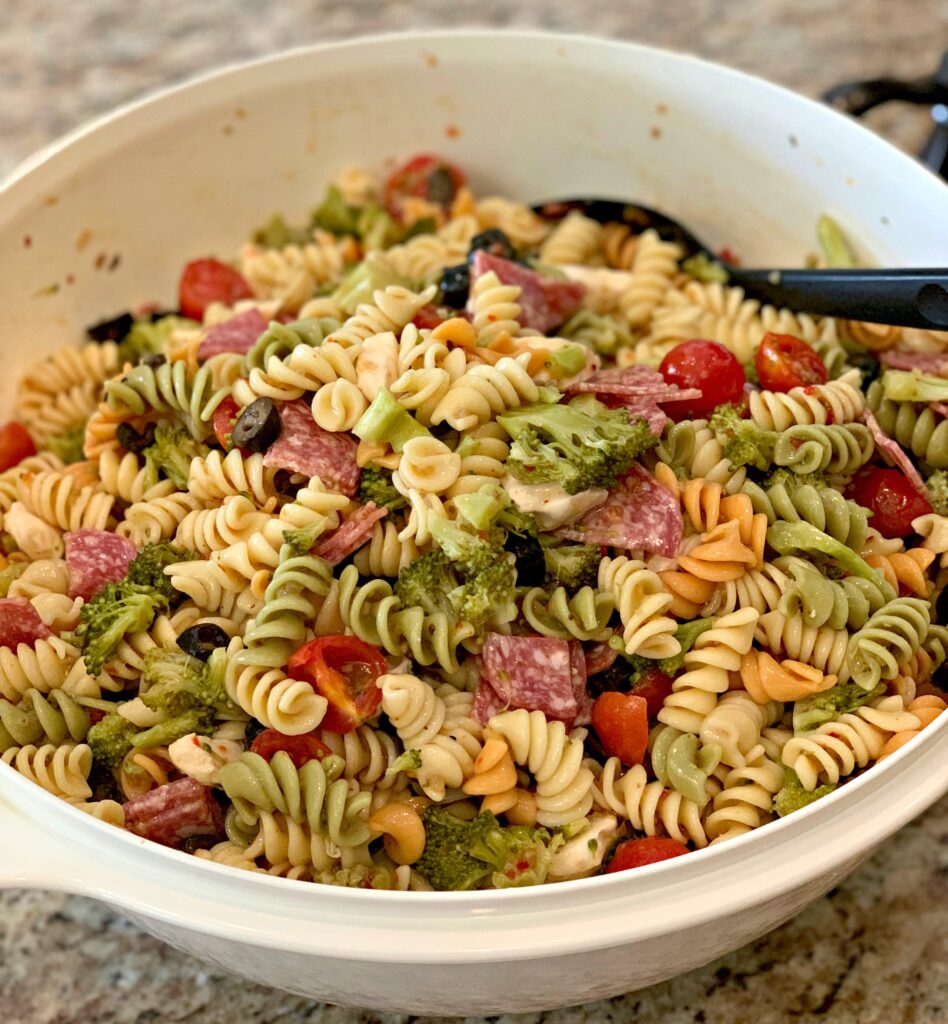 pasta salad with lots of added vegetables and cheeses