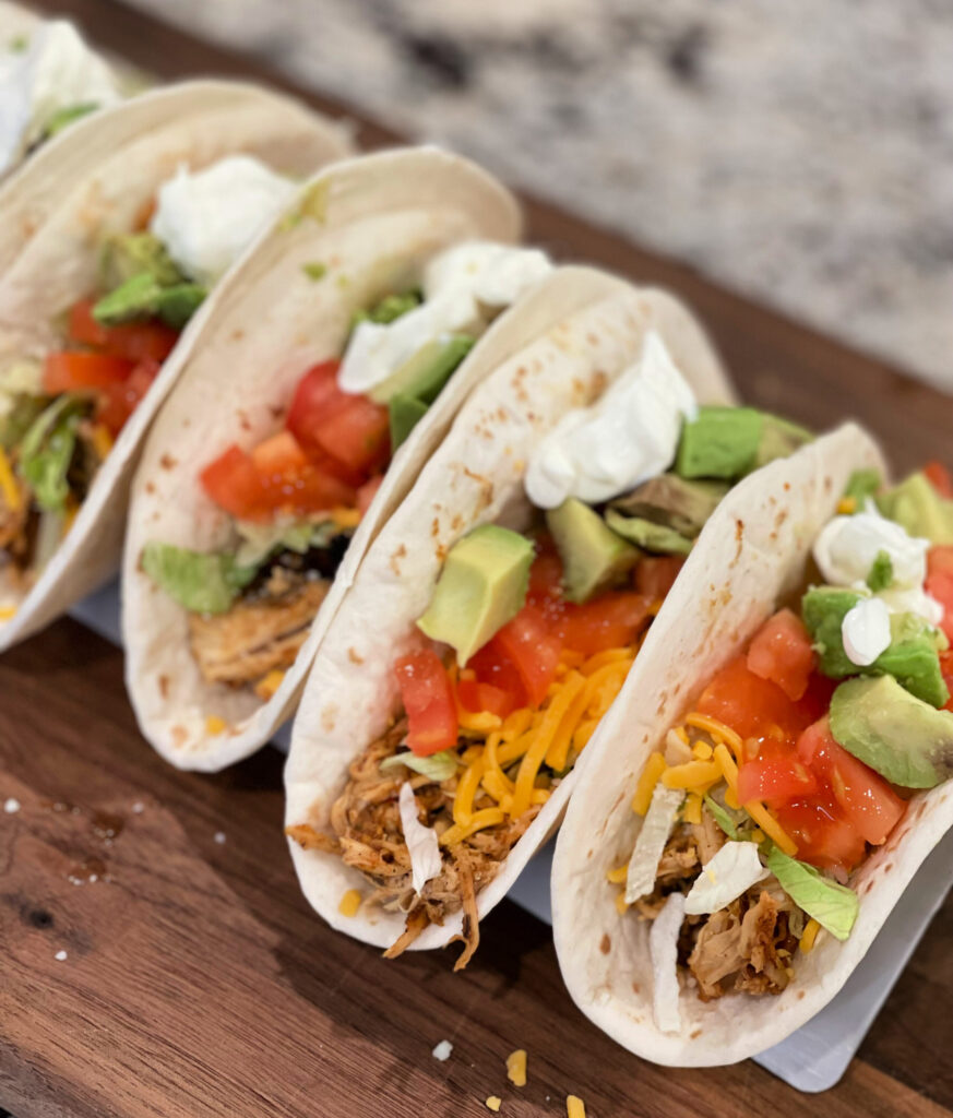 shredded chicken served in tortillas with your favorite toppings