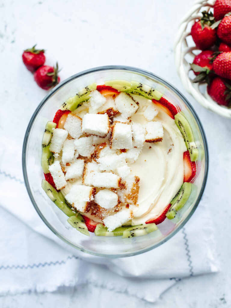 layered strawberries and kiwi with pudding and cool whip.