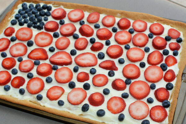 an assembled red, white, and blue fruit pizza perfect for fourth of july