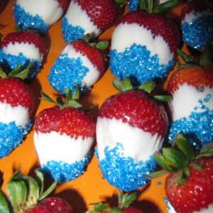 strawberries dipped in white chocolate and blue color sugar for Fourth of July