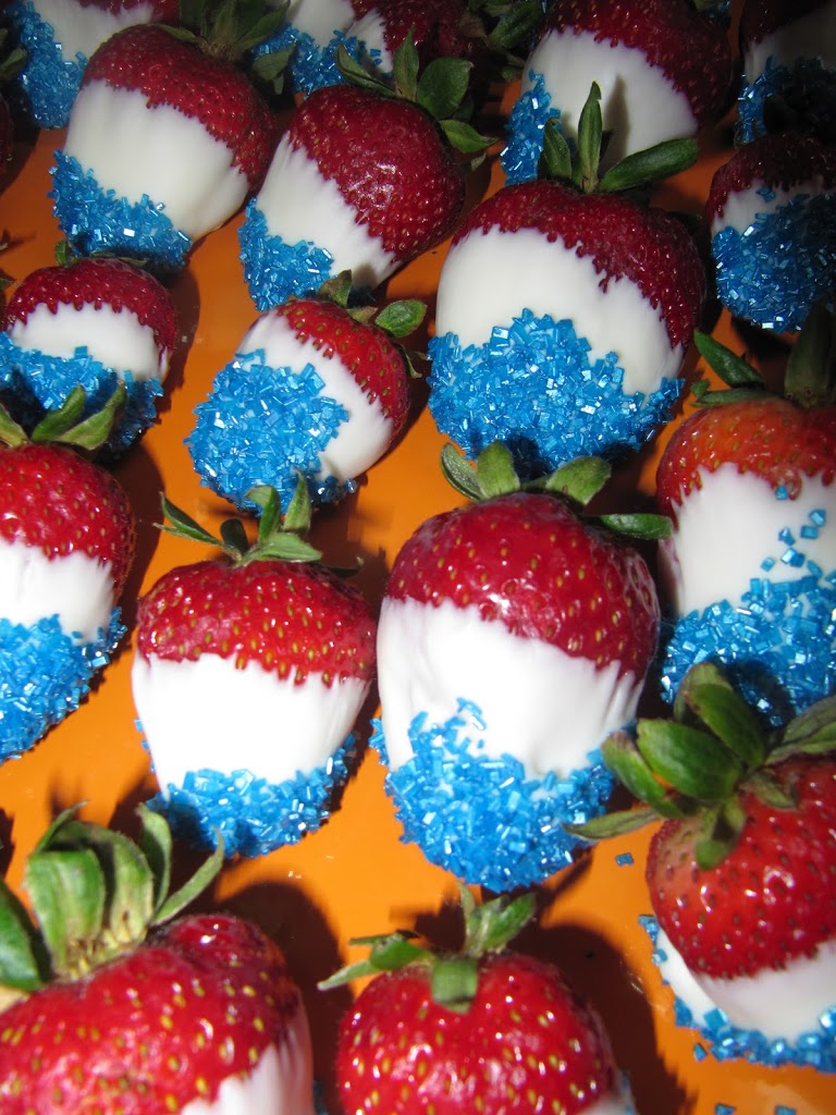 strawberries dipped in white chocolate and blue color sugar for Fourth of July