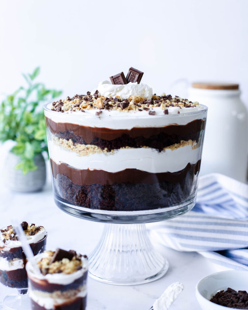 a layered S'mores Trifle in a glass bowl.
