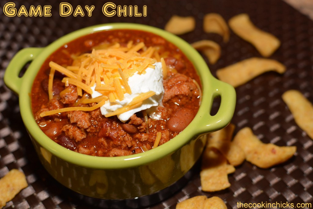 hearty game day chili consisting of beans, beef, tomatoes, seasonings, and more