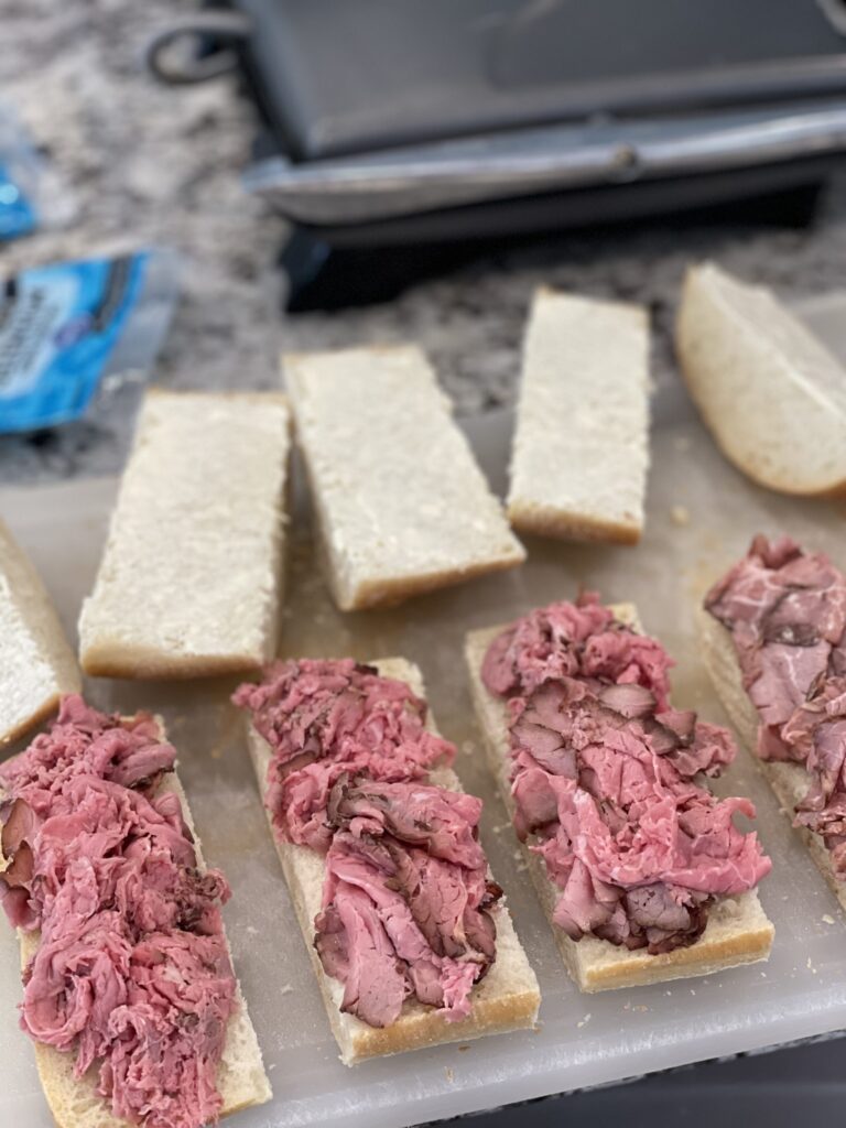 shaved roast beef piled on top of ciabatta bread