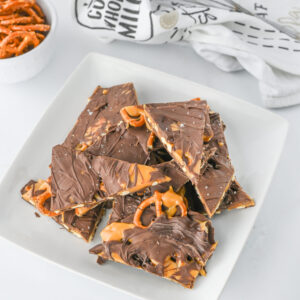 a white plate of a no bake salty sweet dessert.