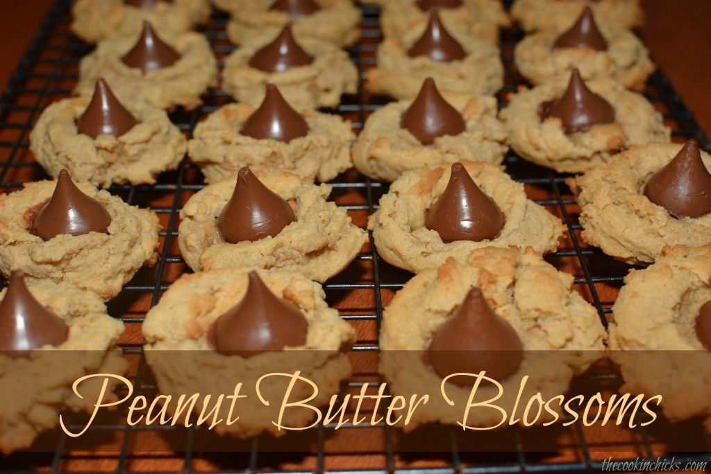 peanut butter blossoms lined up on cooling rack