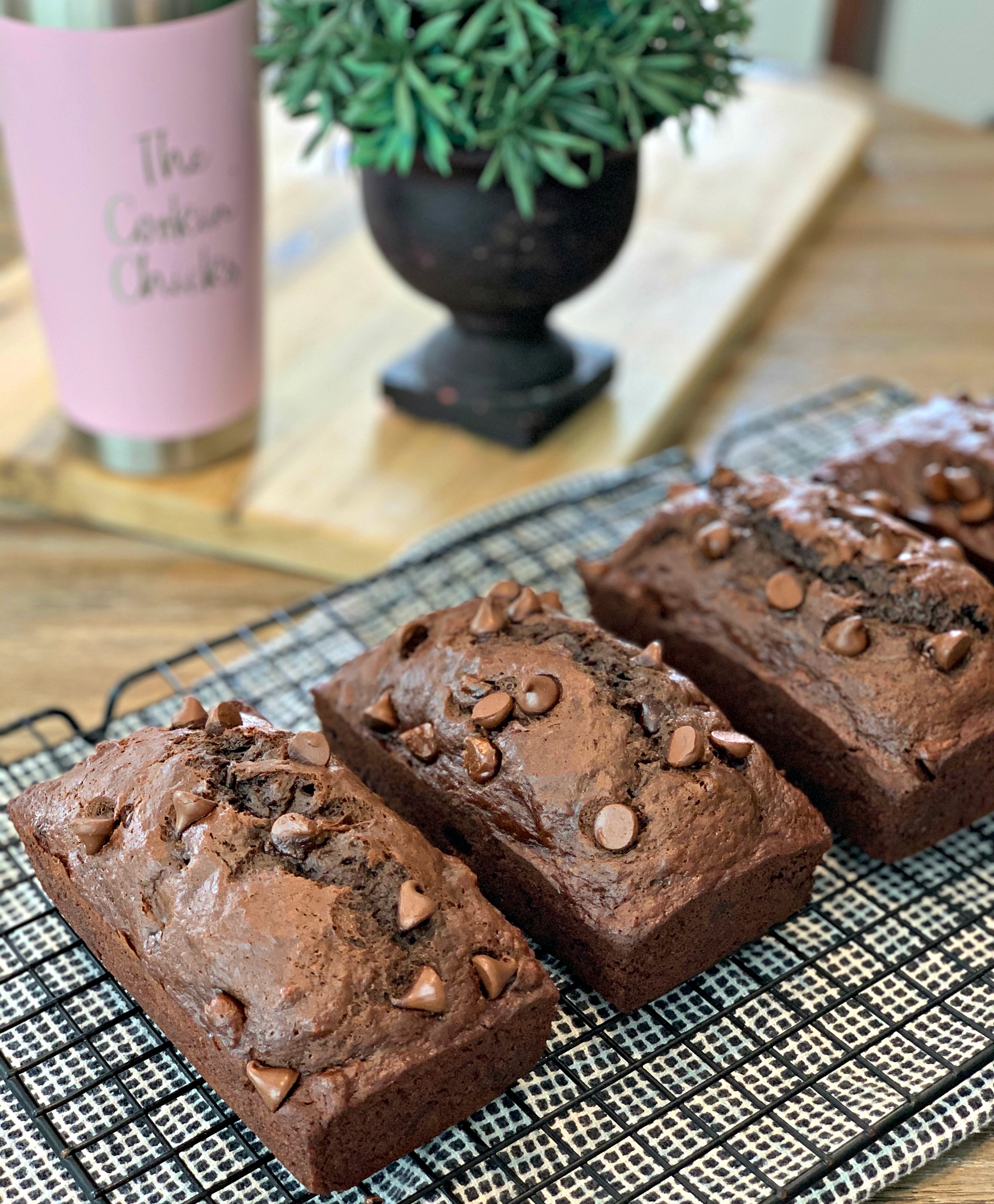 double chocolate banana bread on a black cooling rack.