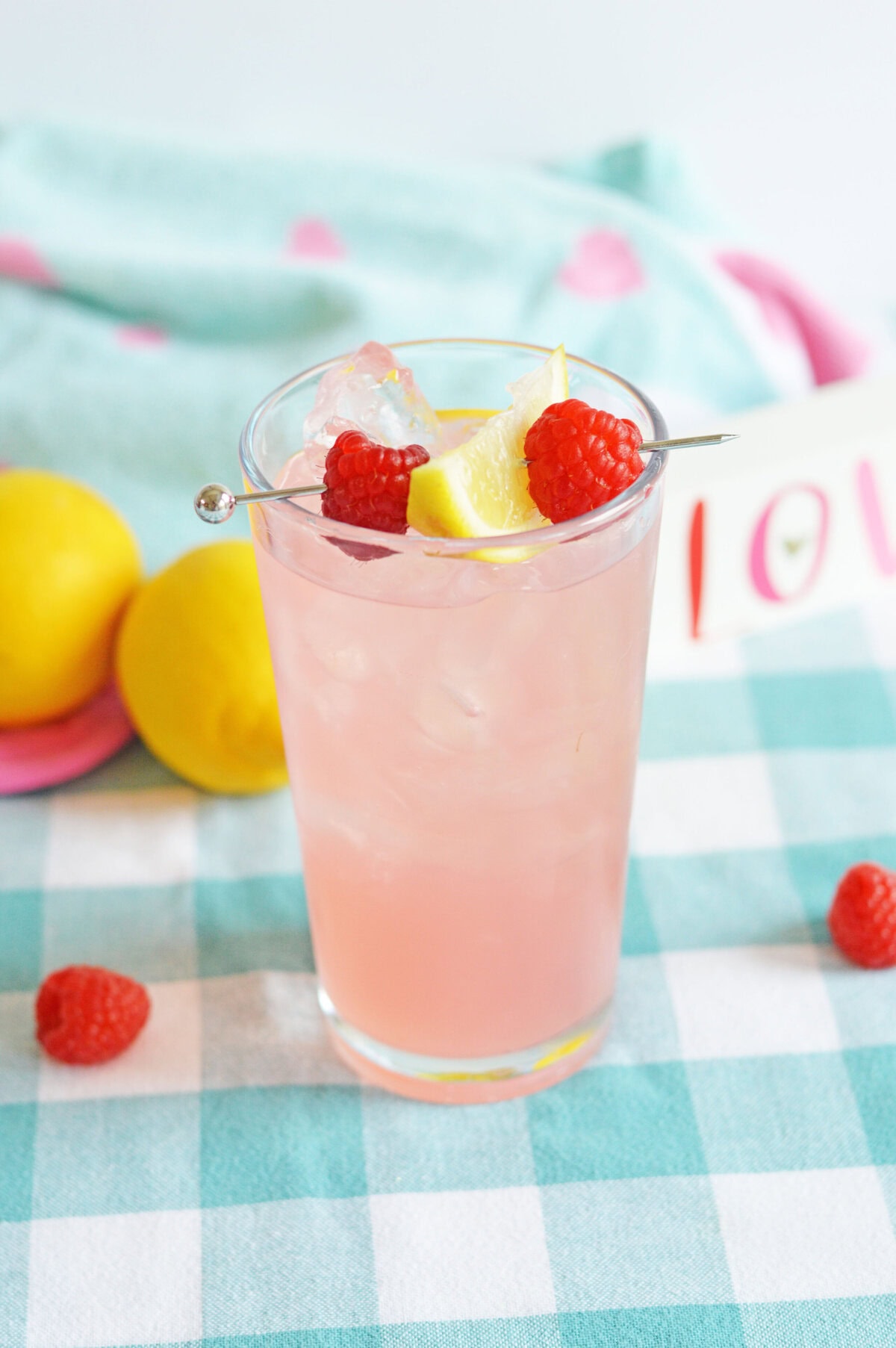 pink lemonade cocktail in a glass with ice.