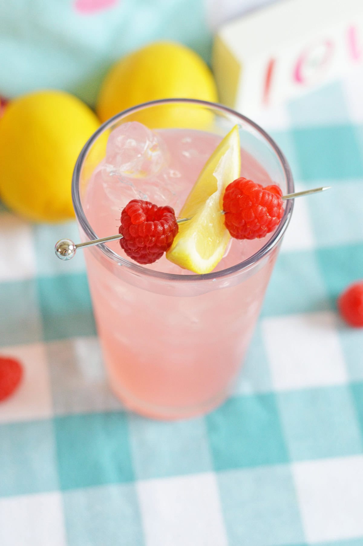 Easy two-ingredient Malibu and lemonade drink served over ice in a clear glass.