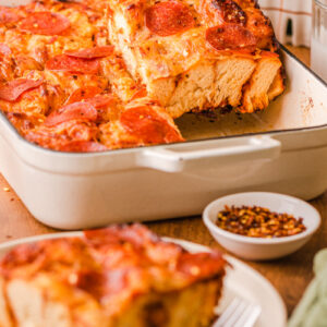 a large slice of pizza bake on a plate