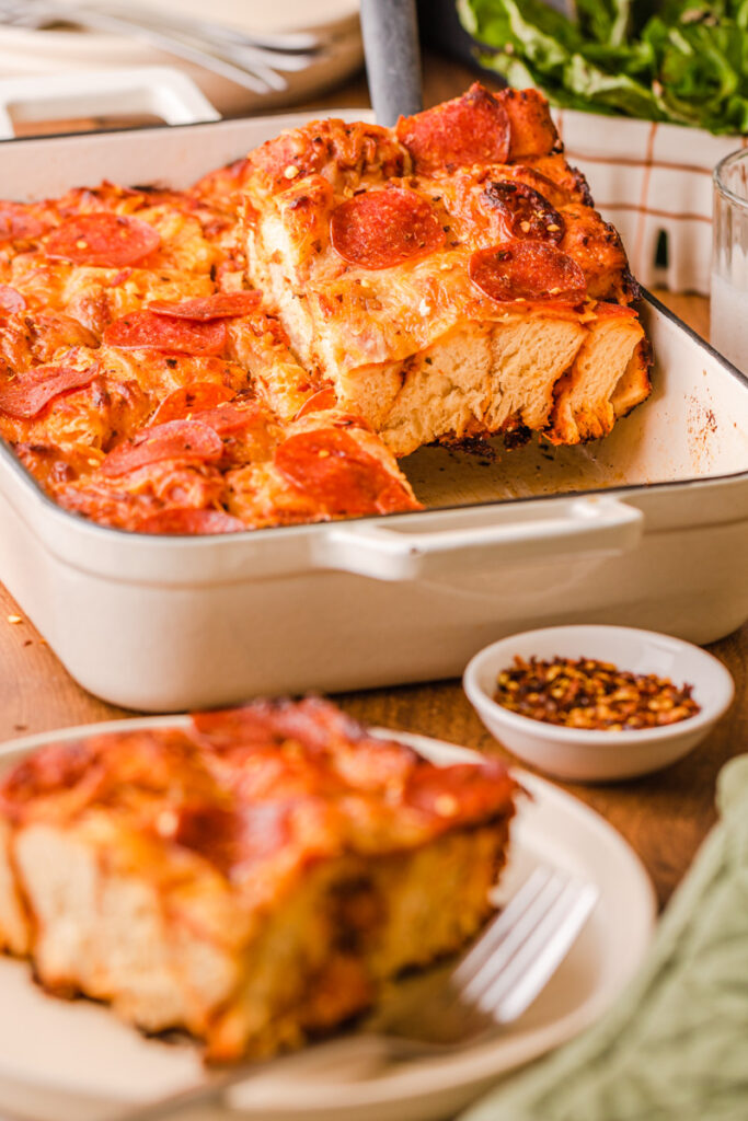 a large slice of pizza bake on a plate