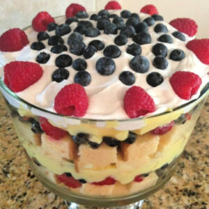 layers of lemon pound cake with pudding and fruit combined into a trifle