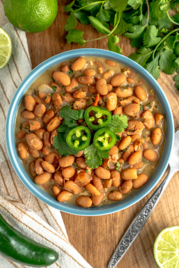 a bowl of frijoles charros ready to serve.
