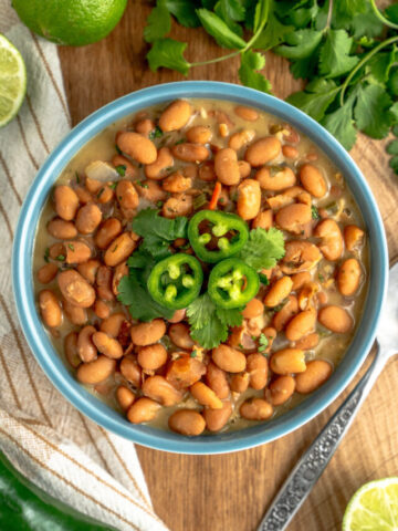 a bowl of frijoles charros ready to serve.