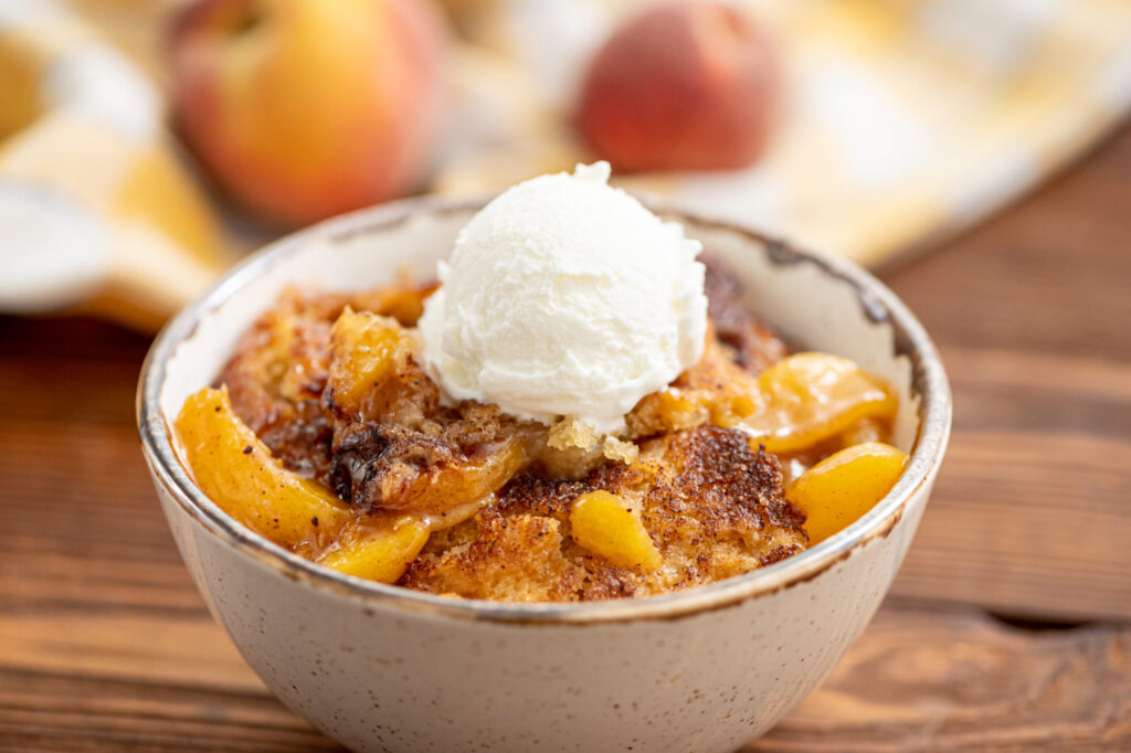 fresh peaches, cinnamon, and a biscuit topping combined into peach cobbler