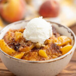 fresh peaches, cinnamon, and a biscuit topping combined into peach cobbler