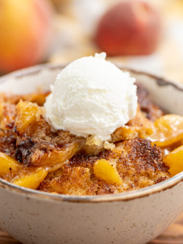 fresh peaches, cinnamon, and a biscuit topping combined into peach cobbler