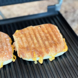 melted cheese over tuna on a ciabatta roll