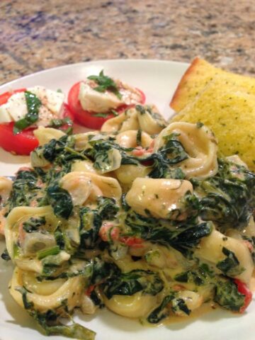 creamy spinach and tomato sauce over tender cheese filled tortellini