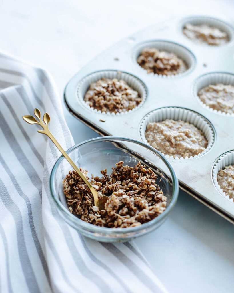 a brown sugar oat topping in a glass bowl to sprinkle on top of baked goods.