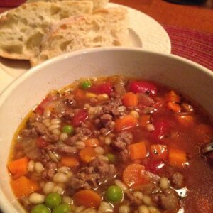 tender barley, vegetables, and beef combined in a flavorful broth