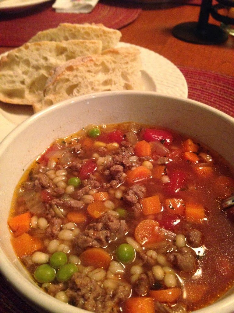beef, barley, vegetables, and tomatoes combined into a savory soup