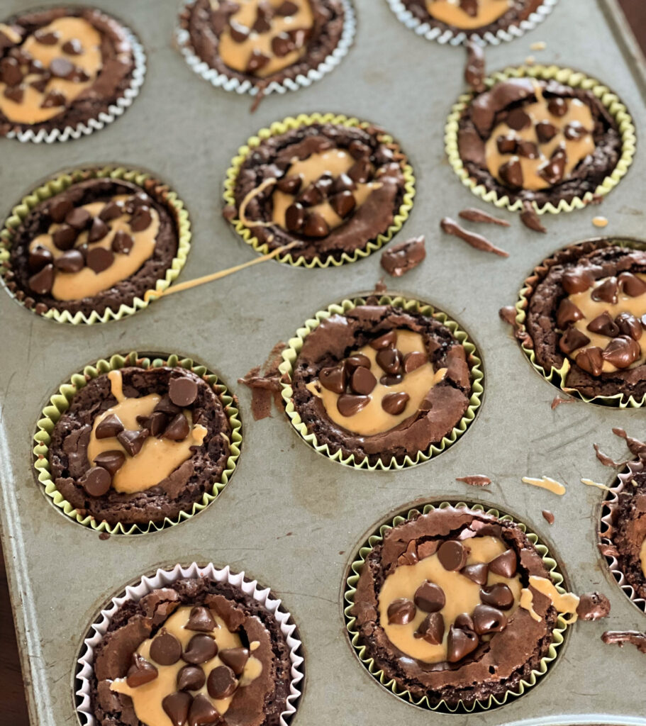 chocolate brownie cups with drizzled peanut butter on top