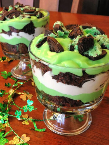 cookies, brownies, cool whip, and pudding combined in this St Patricks Day trifle