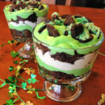 cookies, brownies, cool whip, and pudding combined in this St Patricks Day trifle