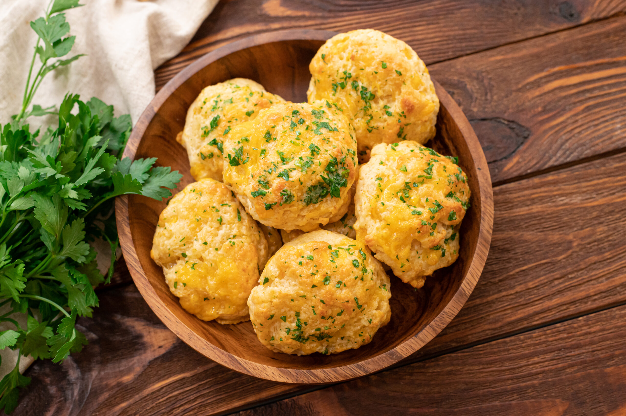 cheddar bay biscuits in a brown bowl.