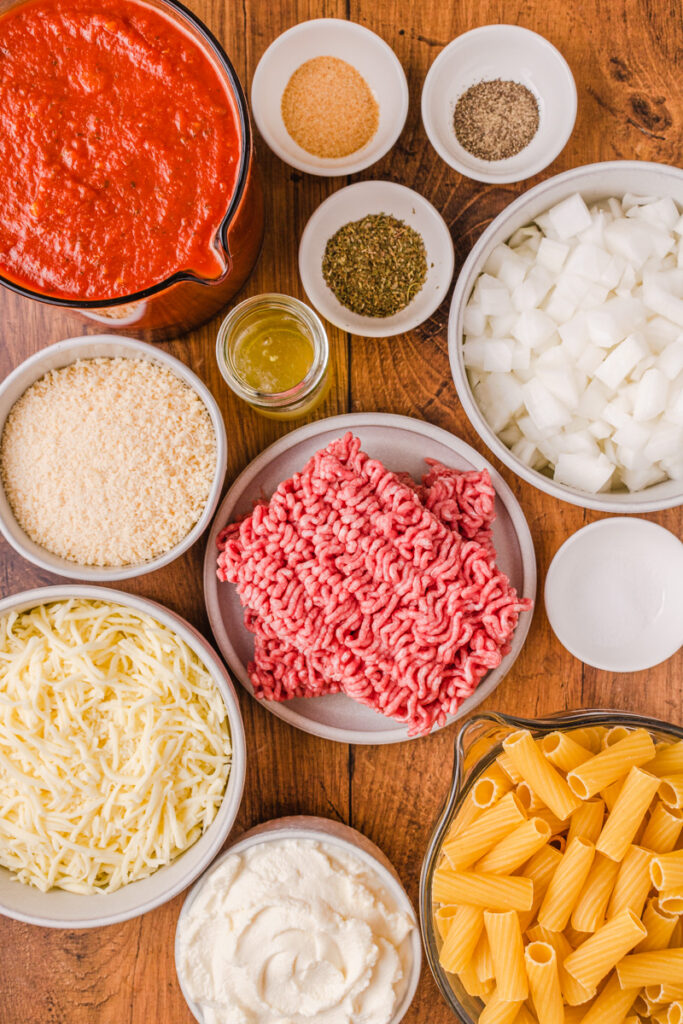 all the ingredients needed to make cheesy crockpot baked ziti