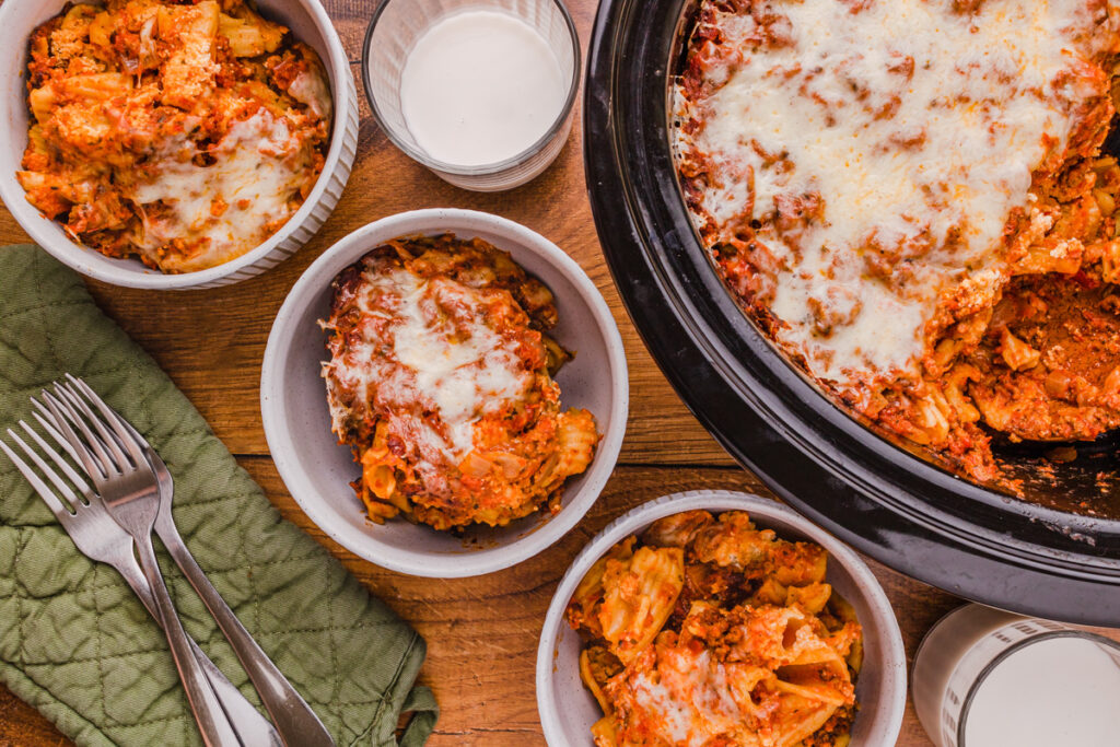 cheesy slow cooker ziti served in bowls ready to eat