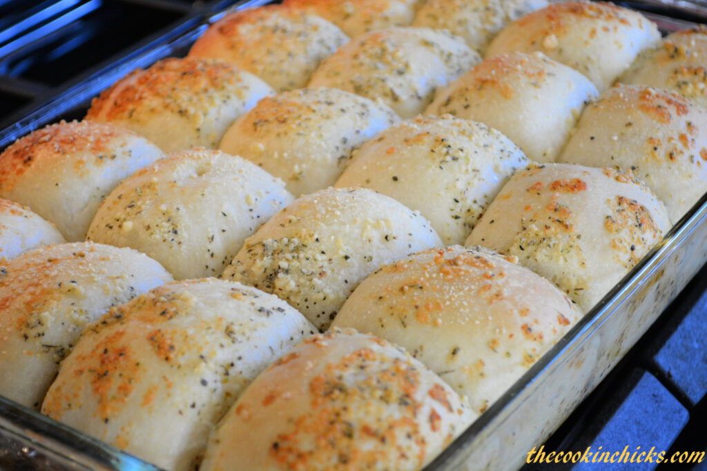 fluffy dinner rolls with a garlic parmesan coating