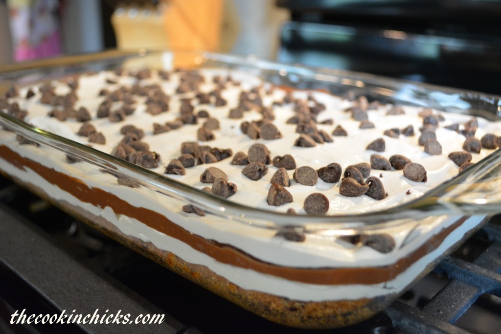 chocolate chip cookie layer followed by a cream cheese layer, pudding layer, and cool whip