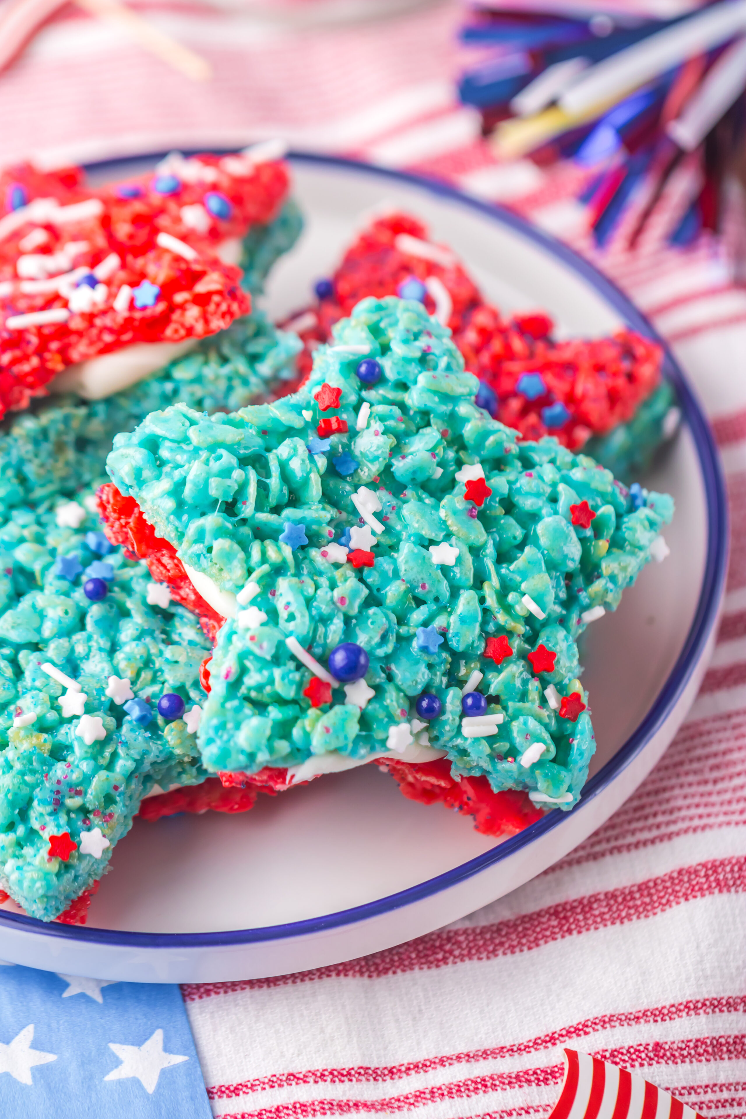 a red, white, and blue star shaped rice krispy treat on a plate.