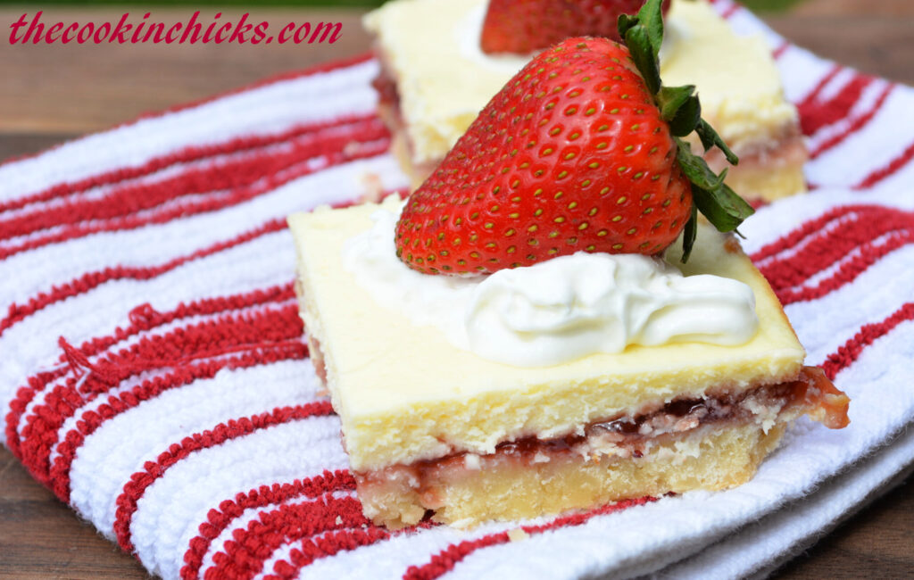 shortbread bars with lemon cream cheese filling and strawberry preserves