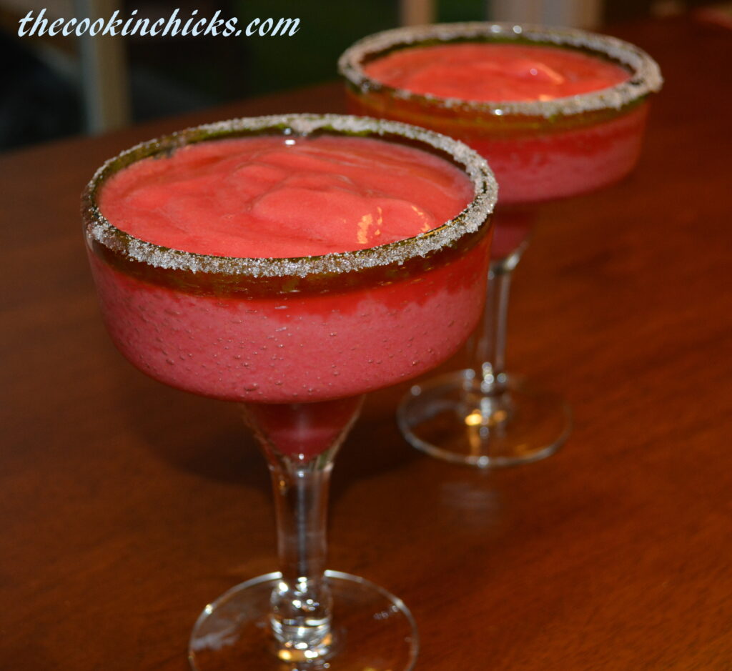 using fresh raspberries blended with ice, tequila, and triple sec, a flavorful margarita is created