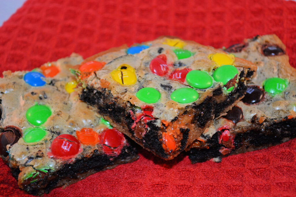 ooey gooey cookie bars with oreo and m & m's throughout