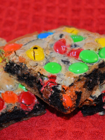 ooey gooey cookie bars with oreo and m & m's throughout