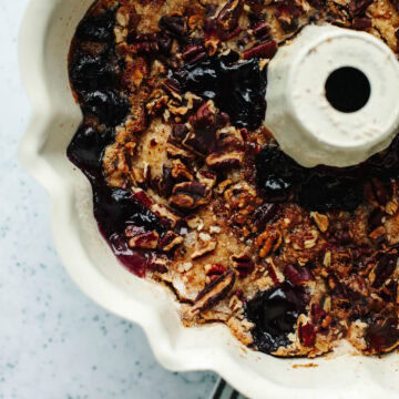 Freshly baked Bisquick blueberry cobbler crisp in a bundt pan with golden topping
