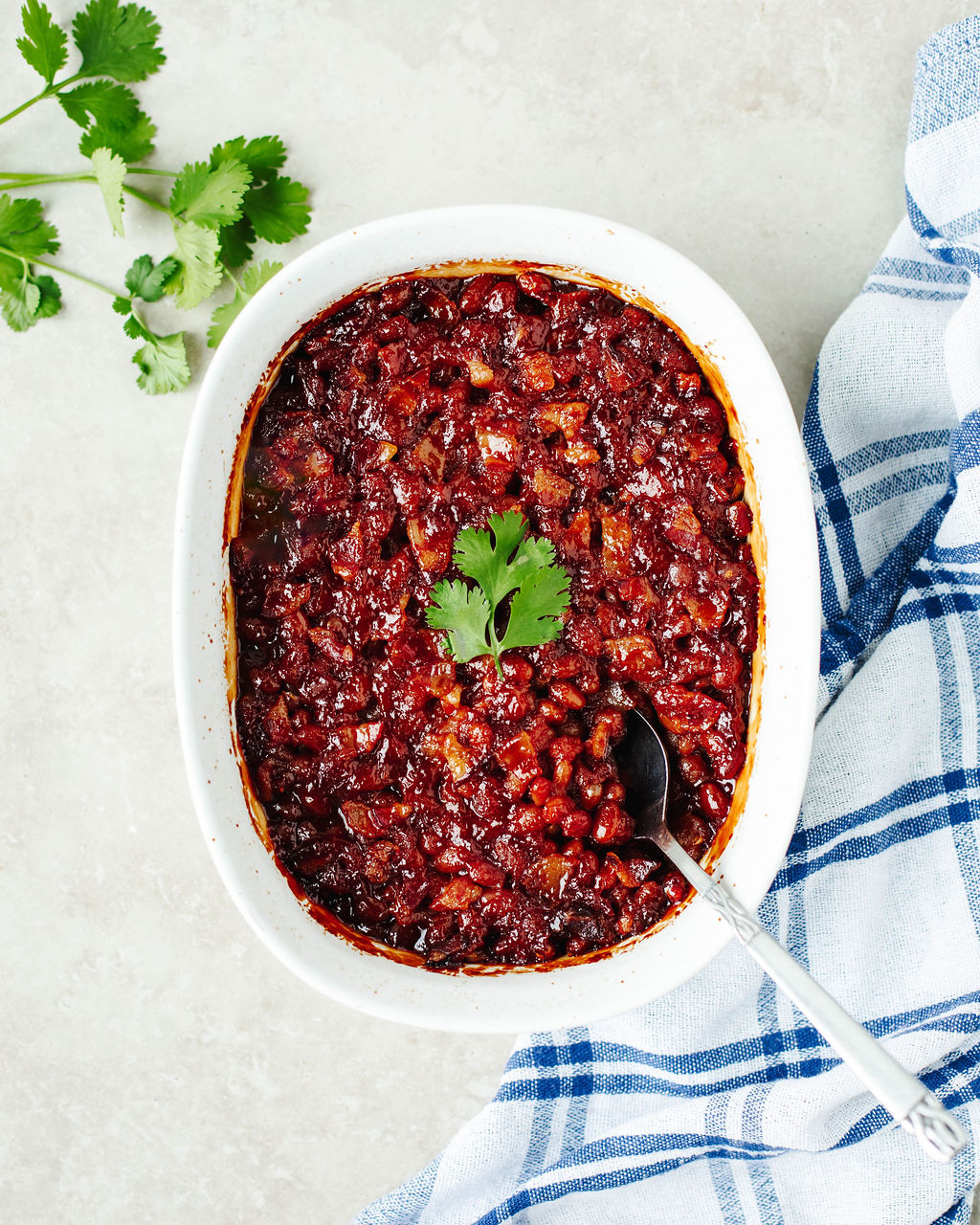 baked beans in a white casserole dish.