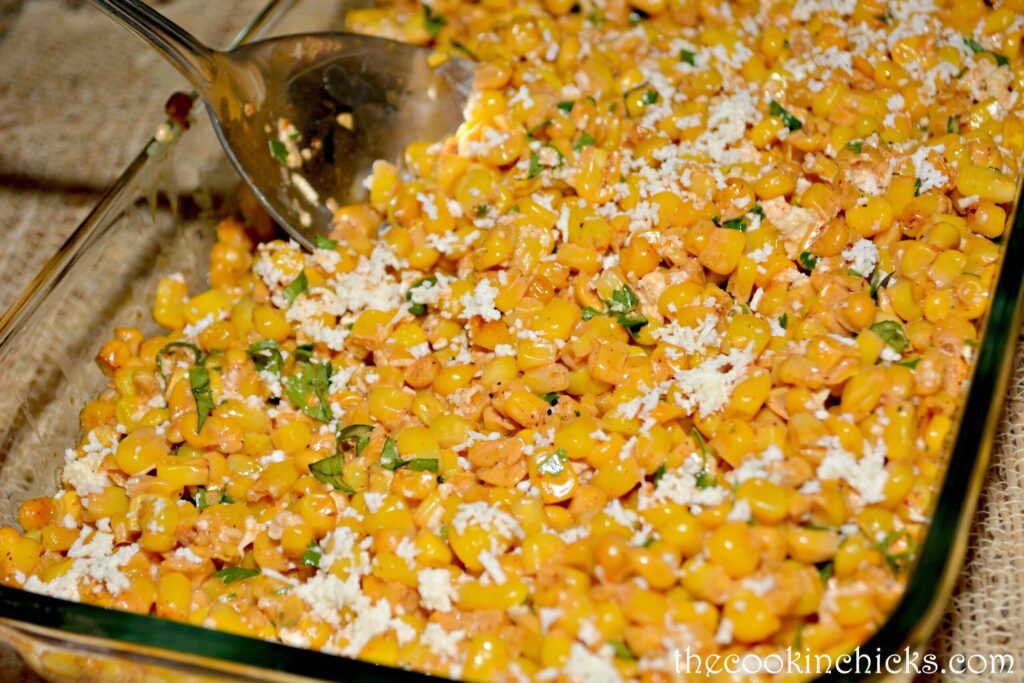 corn cooked with butter and topped with cilantro and cojita cheese
