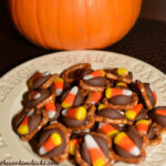 salty and sweet bite sized pretzels with hershey kisses and candy corn
