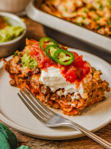 jalapenos, sour cream, and tomatoes over a piece of taco casserole.