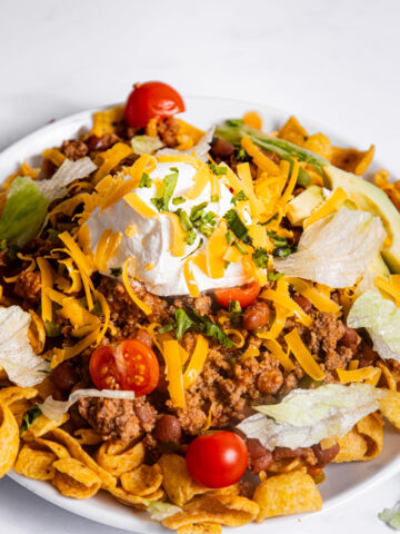 Frito corn chips loaded with a beef mixture and toppings.