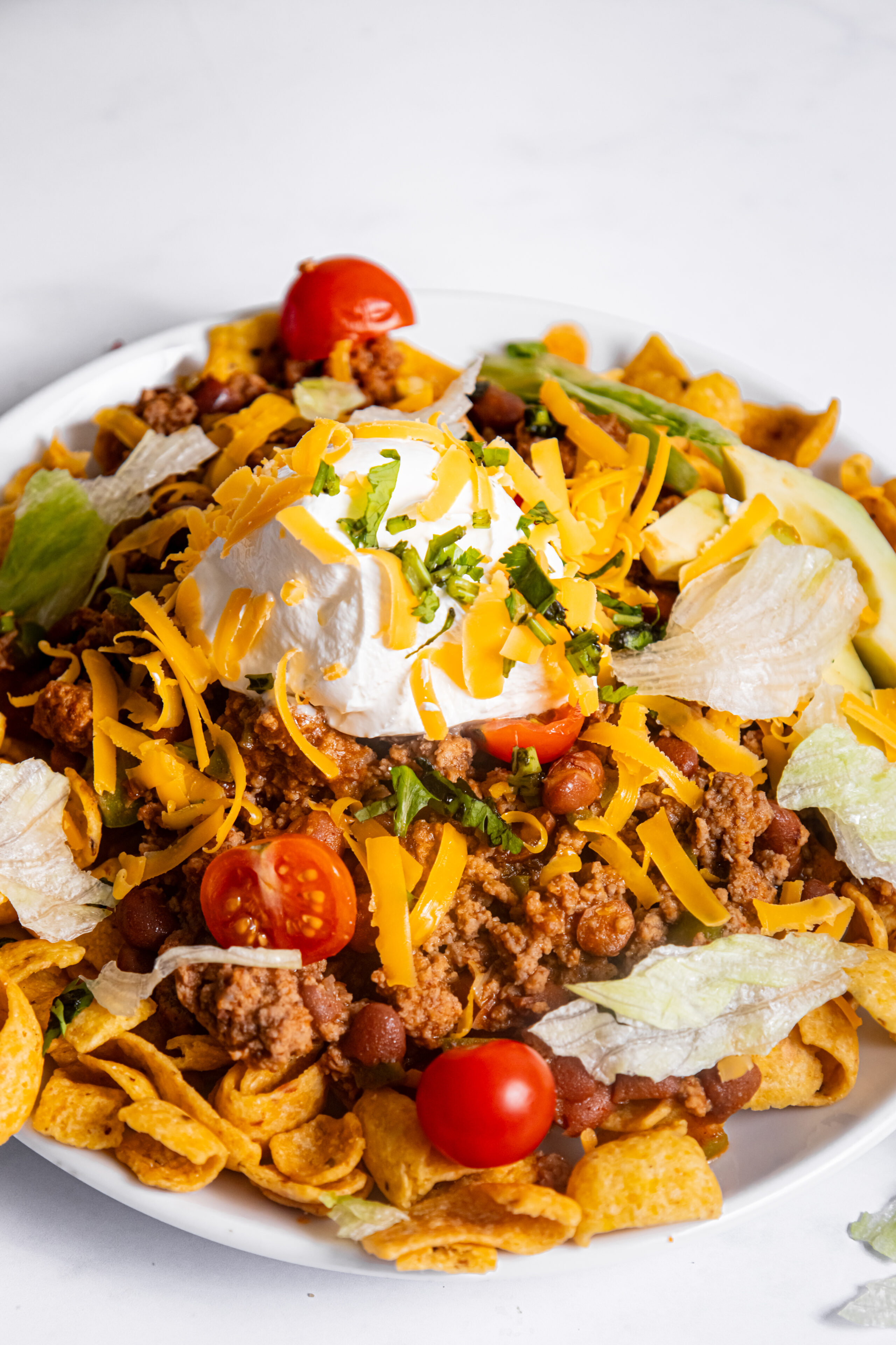 Frito corn chips loaded with a beef mixture and toppings.