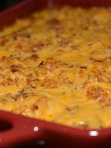 a one pan meal with chicken, cheese, and rice
