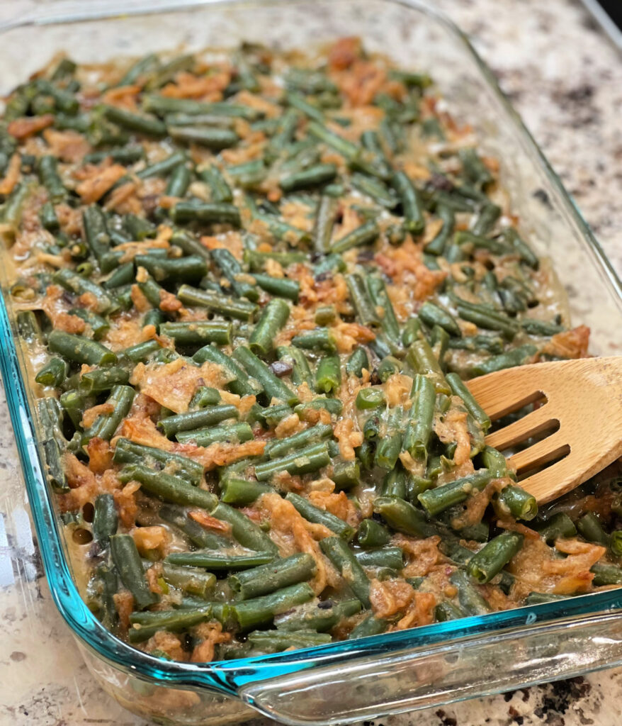 tender green beans with a mushroom sauce and fried onions throughout